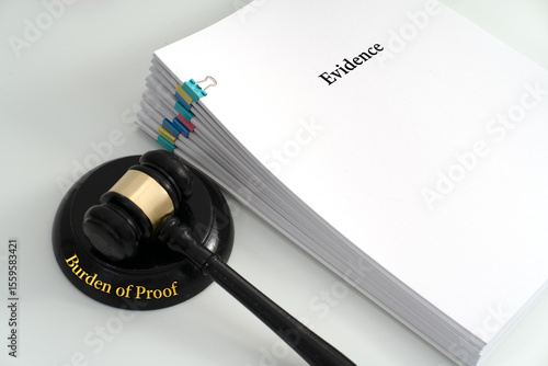 A gavel's base inscribed with 'Burden of Proof' sits beside a stack of documents titled 'Evidence,' symbolizing the legal responsibility to prove a claim in court
