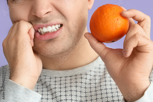 Young man with orange suffe...