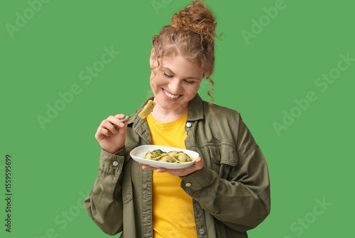 Happy young woman with fork...