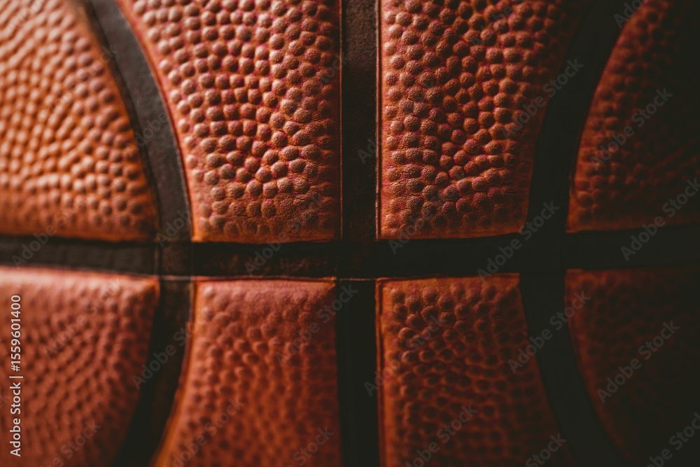 Naklejka premium Basketball surface showing pebble-grain leather and black seams in flat design, dark background