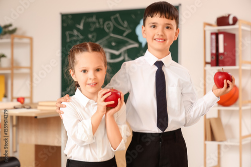 Little schoolchildren with ...