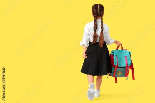 Little schoolgirl with back...