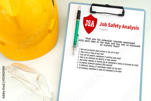 Illustration of a common Job Safety Analysis (JSA) template to be completed before starting a task, featuring safety glasses and a yellow safety helmet