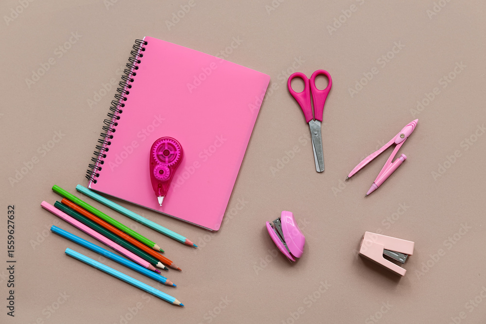 Set of stationery with notebook on color background Set of stationery with notebook on color background