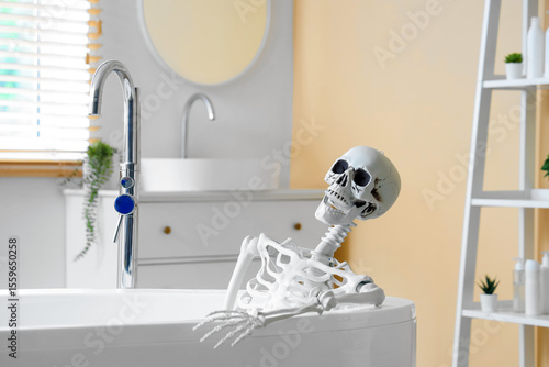 Skeleton lying in bathtub a...