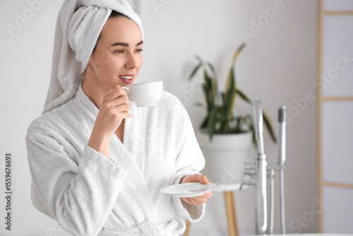 Young woman in soft bathrob...