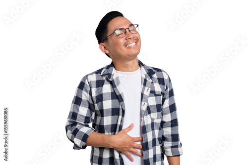 Quadro em tela Happy young Asian man in casual shirt feeling happy after eating delicious food,