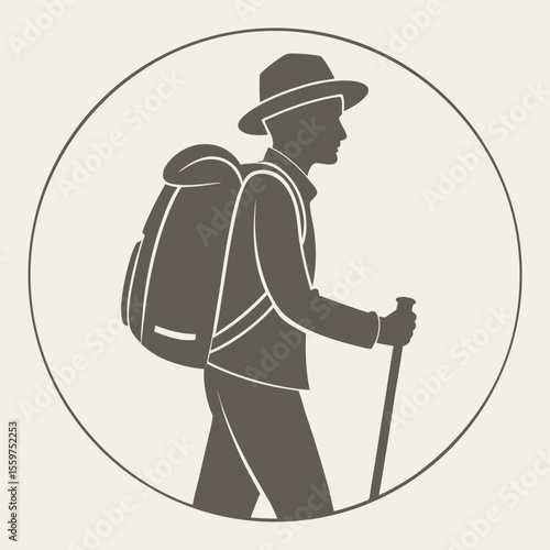 A Man Wearing a Hat and Backpack Walks with a Cane