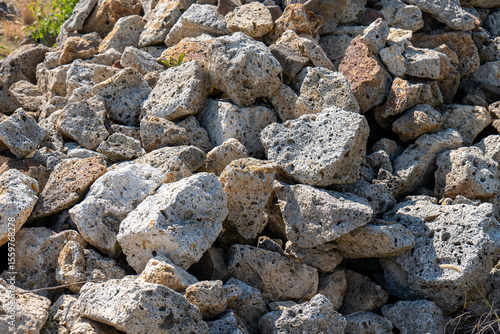 Wall Mural Pile of porous volcanic tuff stones in sunlight