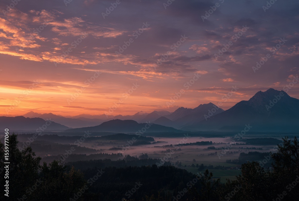 Naklejka premium sunset over the mountains