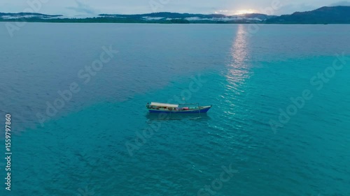 Aerial view of traditional Asian fishing boats in the middle of the ocean