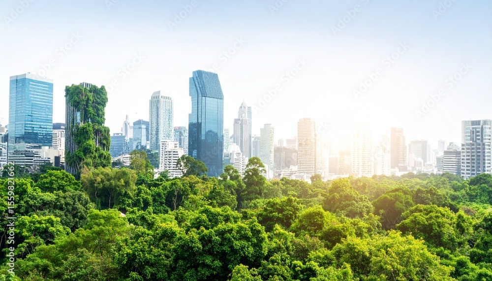 Fototapeta premium Double exposure of lush green forest and modern skyscraper representing a green city