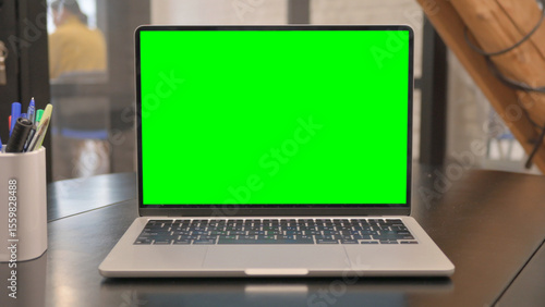 Laptop with Chroma Key Screen on Desk