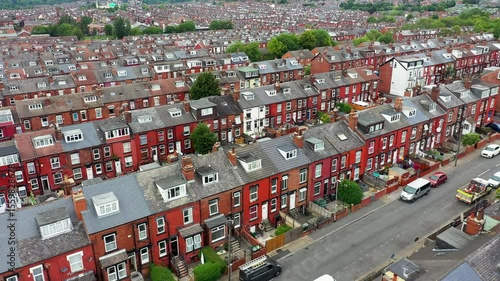 Aerial drone footage of the city of Leeds showing the area know as Harehills with rows of typical British West Yorkshire terrace houses and suburban British neighbourhood