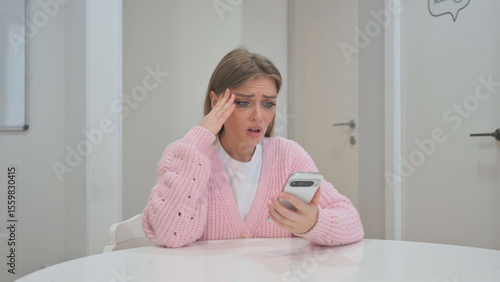 Business Woman with Trading Loss on Phone