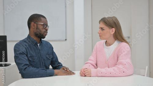 Close up of Middle Aged man Talking Woman in Meeting