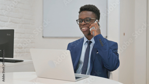 Young African Businessman on a Phone Call