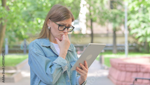 Canvas Print Young Woman Reacting with Shock or Disbelief to Tablet Content