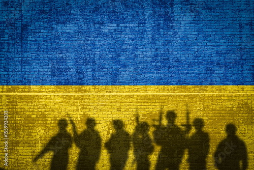 Obraz na plátně Conceptual image of war between Russia and Ukraine with shadow of soldier agains