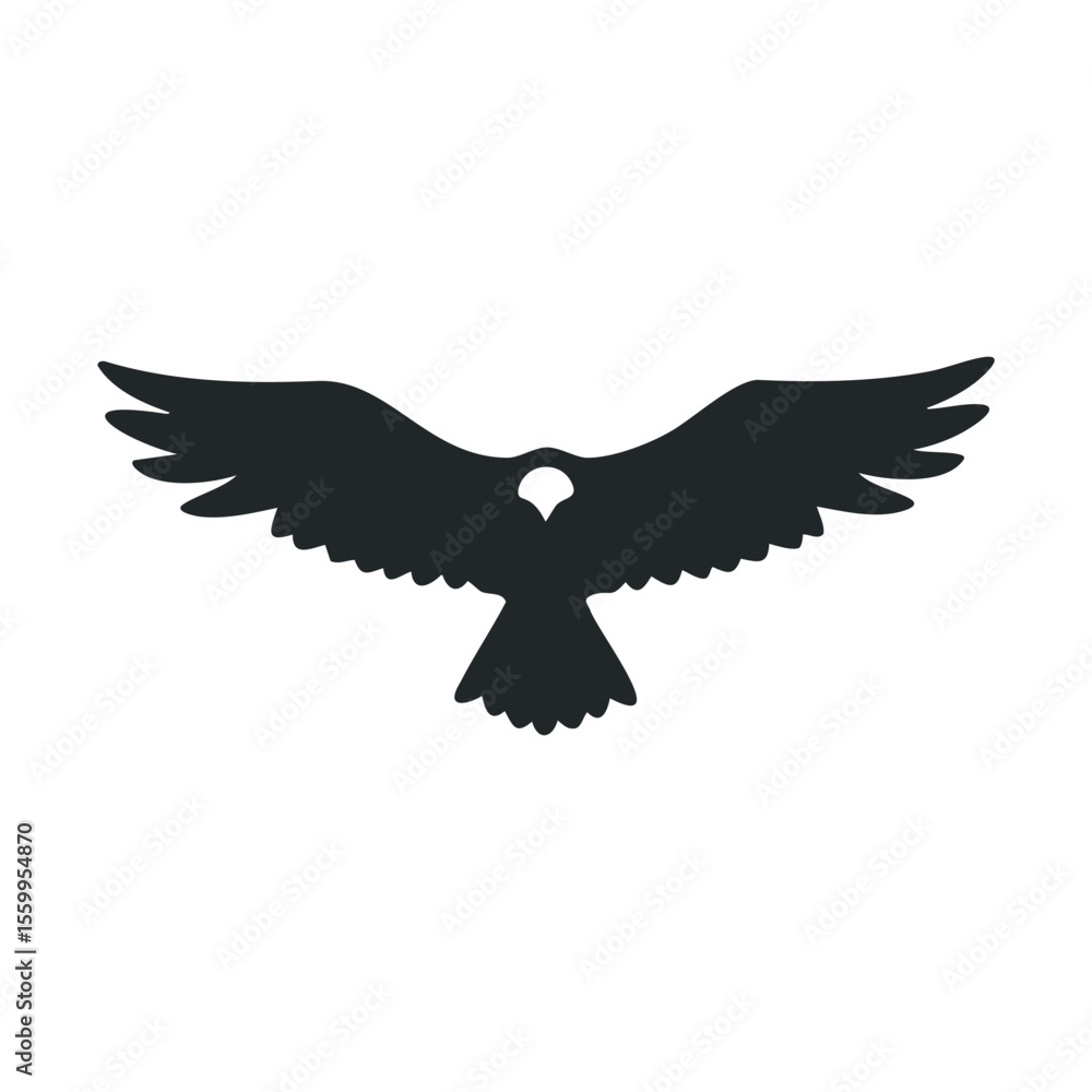 Silhouette of a flying eagle with spread wings.
