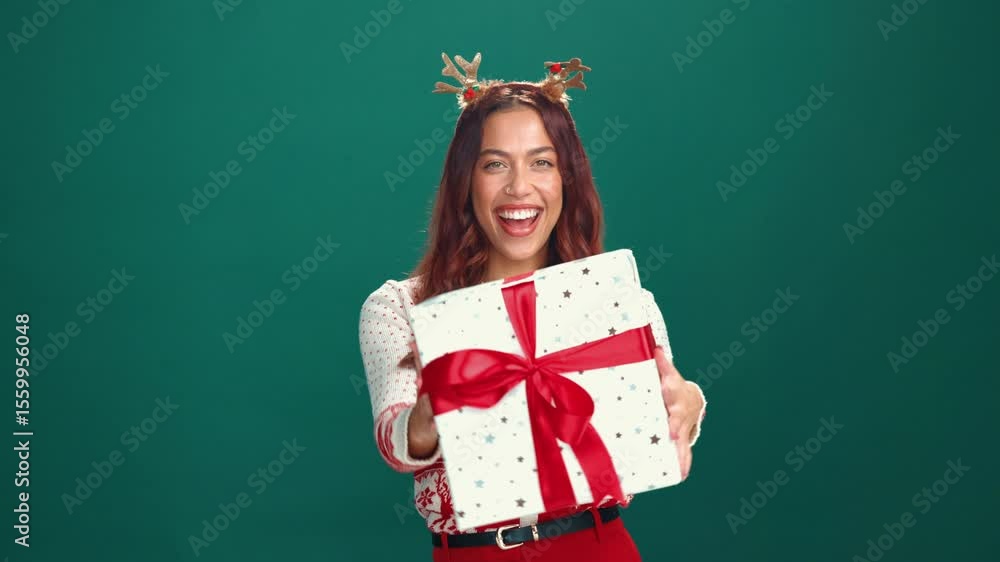 Smile, Christmas gift and face of woman in studio for celebration, giveaway or surprise. Excited, xmas holiday and portrait of person with present box for festive tradition by green background space Smile, Christmas gift and face of woman in studio for celebration, giveaway or surprise. Excited, xmas holiday and portrait of person with present box for festive tradition by green background space
