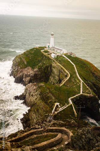 South Stack Lighthouse, North Wales, UK white light house at the end of a long winding path down to sea