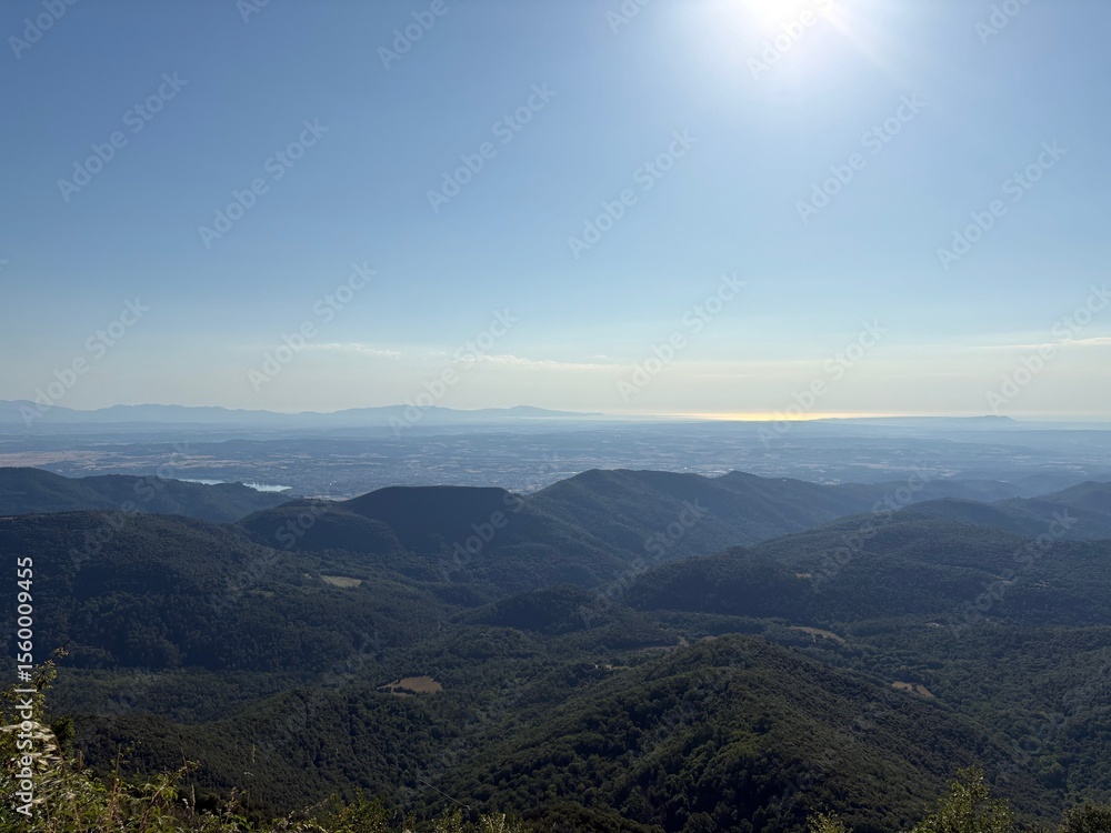 Fototapeta premium Mountain landscape with long view on the horizon to the Mediterranean Sea in Girona