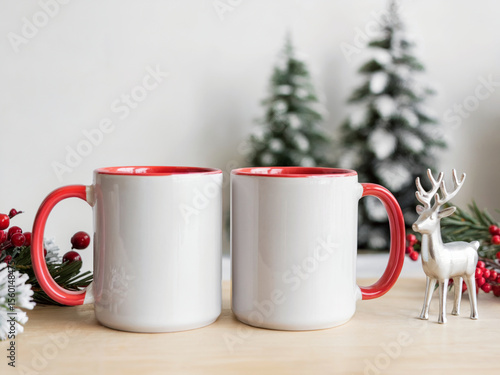 Wallpaper Mural A product photography shot of two white ceramic mugs with red interior and red handles, positioned side by side on a light wooden surface Torontodigital.ca