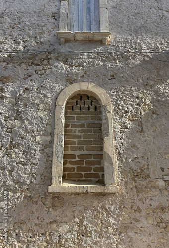 Wallpaper Mural Old facade window of a building. Closed shutters in the window. Window facing a sunny street in Sicily, Italy. Torontodigital.ca