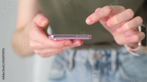 Closeup shot of business woman reading message or downloading an app on mobile phone, browse social network.Online life in cell phone device on internet