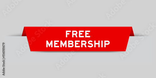 Red color inserted label with word free membership on gray background