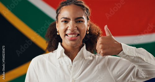 South Africa, flag and portrait of happy woman with thumbs up, confidence and country loyalty. Rainbow nation, promote and proud African girl with yes sign for nationality, citizenship or patriotism