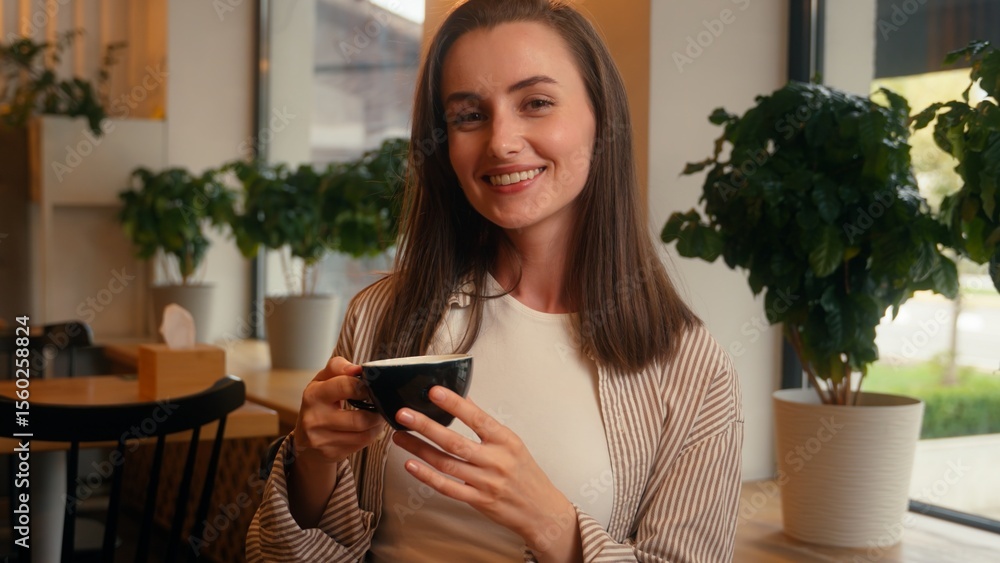 © Yuliia - Caucasian woman sitting in cafe female girl drinking tea coffee hey you pointing gesture come here invitation looking at camera sit at table in cafeteria with croissant inviting welcome breakfast © Yuliia - Caucasian woman sitting in cafe female girl drinking tea coffee hey you pointing gesture come here invitation looking at camera sit at table in cafeteria with croissant inviting welcome breakfast