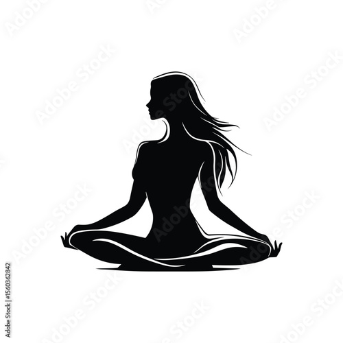 Silhouette of a woman meditating in yoga lotus pose
