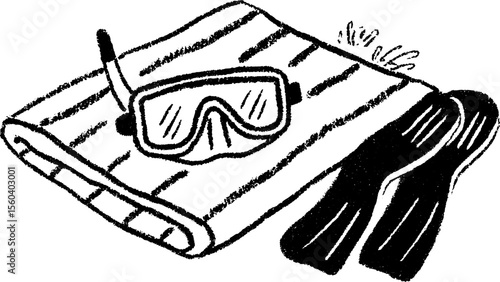 Snorkel mask and flippers on towel for beach vacation preparation