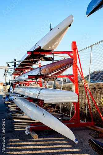 Group of Crew Rowing Boats on a Storage Rack