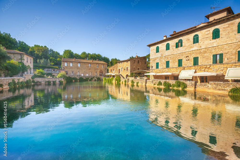 Obraz premium Bagno Vignoni village and thermal baths or hot pool. Tuscany, Italy.