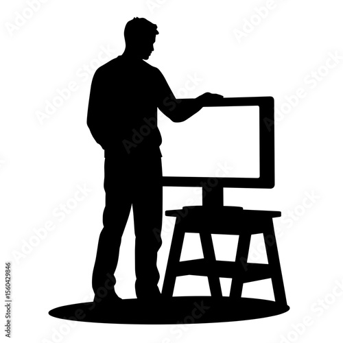 Man presenting ideas in silhouette next to an empty easel  