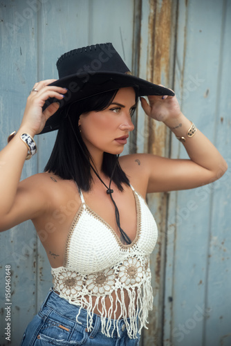 Young woman wearing cowboy hat 