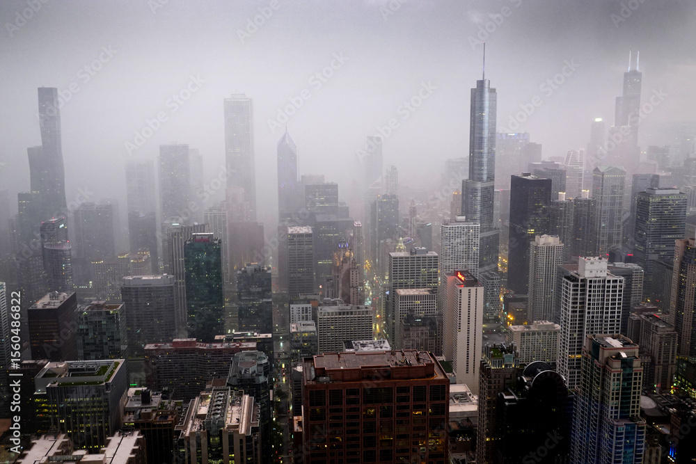 Fototapeta premium Highrise Buildings or Skyscrapers in Big City During Rainstorm with Rain Drops on Window
