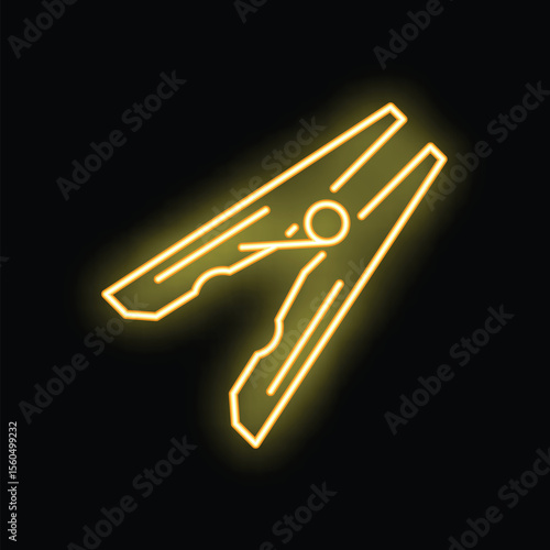 Neon yellow clothes peg glowing on black background, concept for dry cleaning, laundry, housework or clothes shop
