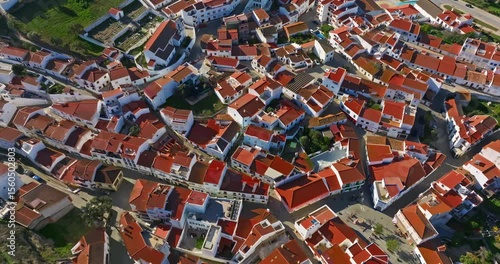 Aerial view of small village with windmill and picturesque rooftops, Odeceixe, Portugal