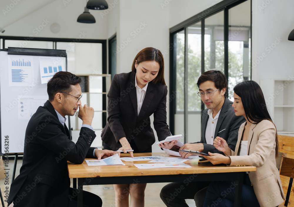 Business Meeting Discussion: A group of business professionals engaged in focused discussions during a meeting, fostering collaboration. Business Meeting Discussion: A group of business professionals engaged in focused discussions during a meeting, fostering collaboration.