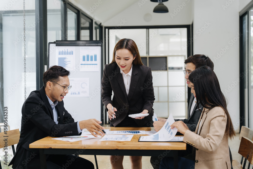Focused Collaboration: A business team intently reviews data and strategies, their faces reflecting deep concentration and cooperative effort. Focused Collaboration: A business team intently reviews data and strategies, their faces reflecting deep concentration and cooperative effort.