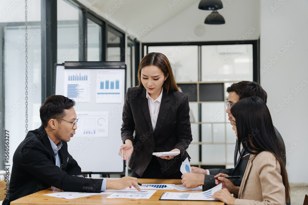 Leadership in Action: A decisive leader guides a focused team in a dynamic business meeting, analyzing data and collaborating toward shared goals. Leadership in Action: A decisive leader guides a focused team in a dynamic business meeting, analyzing data and collaborating toward shared goals.