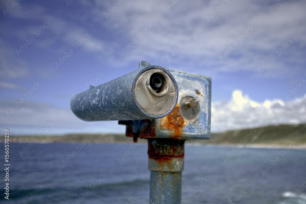 Rusting Coin Operated Telescope in Sennen Cove, Cornwall, United Kingdom Rusting Coin Operated Telescope in Sennen Cove, Cornwall, United Kingdom
