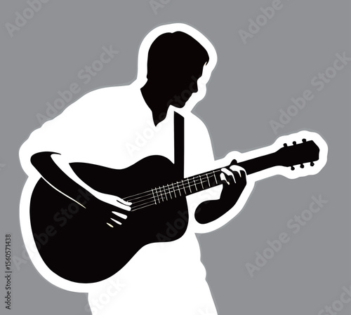 Silhouette of a male guitarist passionately playing a black acoustic guitar.