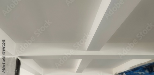 Ceiling and frame in the classroom. White ceiling with geometric shapes