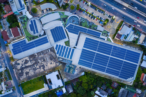 Solar roof, Solar on the roof, top view worker installing a solar cell on the factory roof, panels on tin roof seen from aerial view, panesl power.	