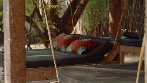 Swing bed, relaxing hotel furniture outdoors, jungle travel